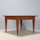 Antique Directoire table in walnut and cherry, Italy, 19th century.