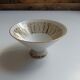 Solitaire tea cup, saucer, and dessert plate in white and gold.