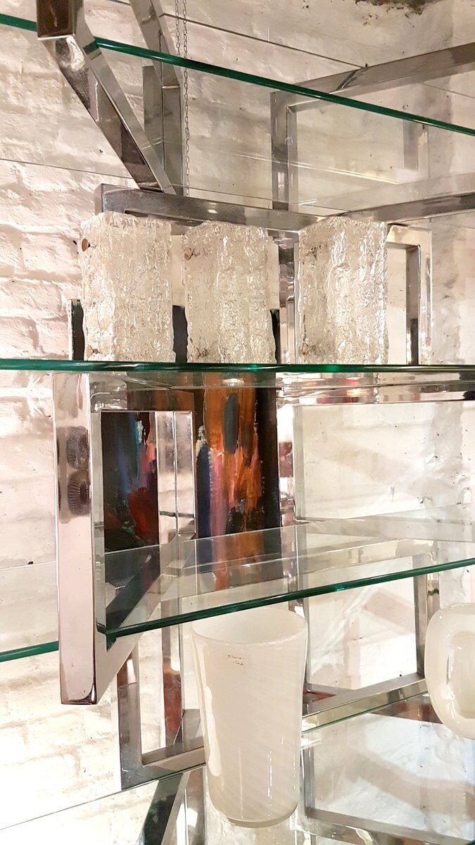 Articulated presentation shelf in chrome and glass. Italy 1970s