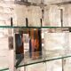Articulated display shelf in chrome and glass. Italy 1970.
