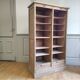 Antique furniture with double curtains sanded to white