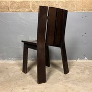 Brutalist and modernist dining chairs from the 1970s in architectural brown wood.