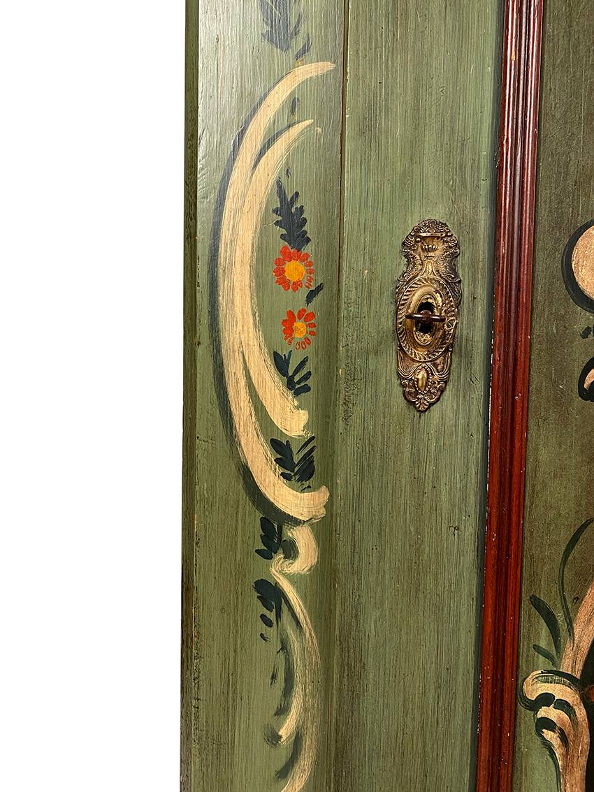 Alsatian bonnet maker in painted softwood with floral decorations