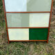 Vintage 1960s display shelf with sliding glass doors.