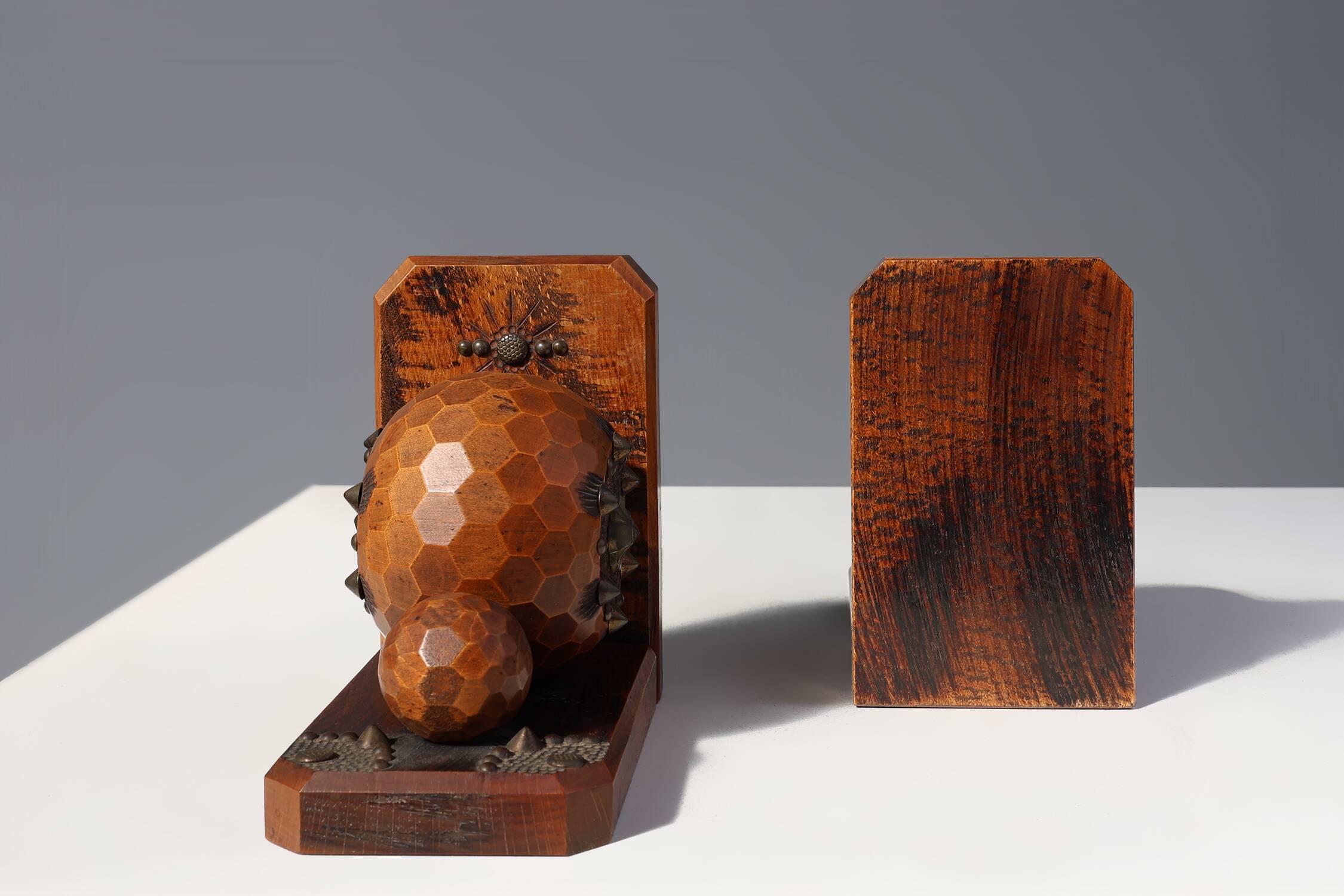 Pair of Art Deco faceted ball bookends in oak with metal decorations