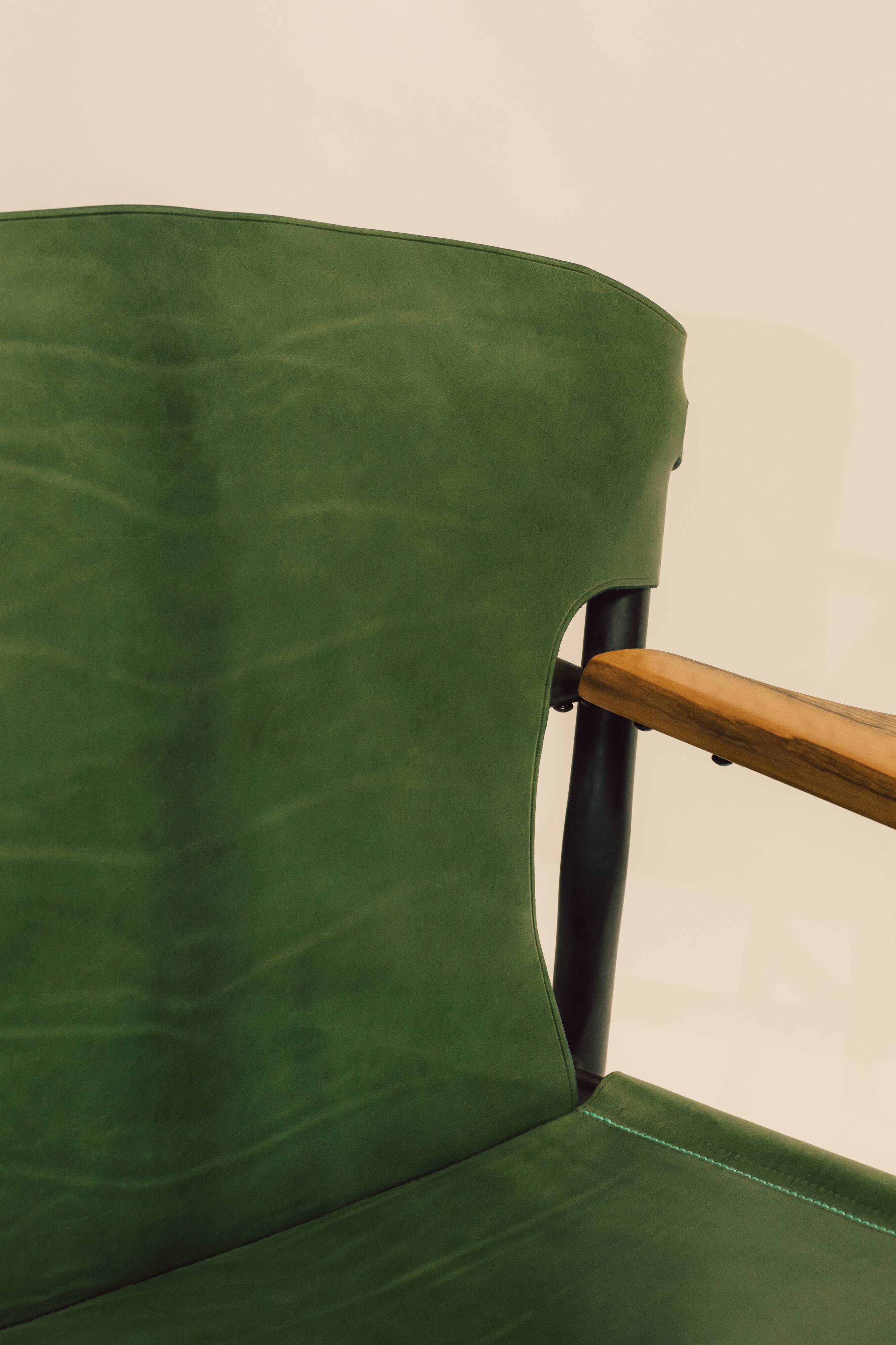 Maërl armchair, Galathée model, green leather, solid wood armrests of your choice