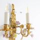 Pair of bronze wall lights with flower decoration. Circa 1880.