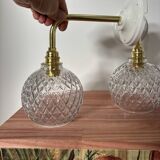 Pair of chiseled glass globe wall sconces