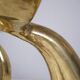 Solid brass dolphin console feet.