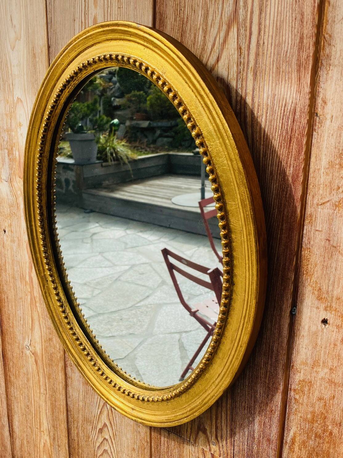 Antique gold oval mirror