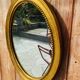 Antique gold oval mirror
