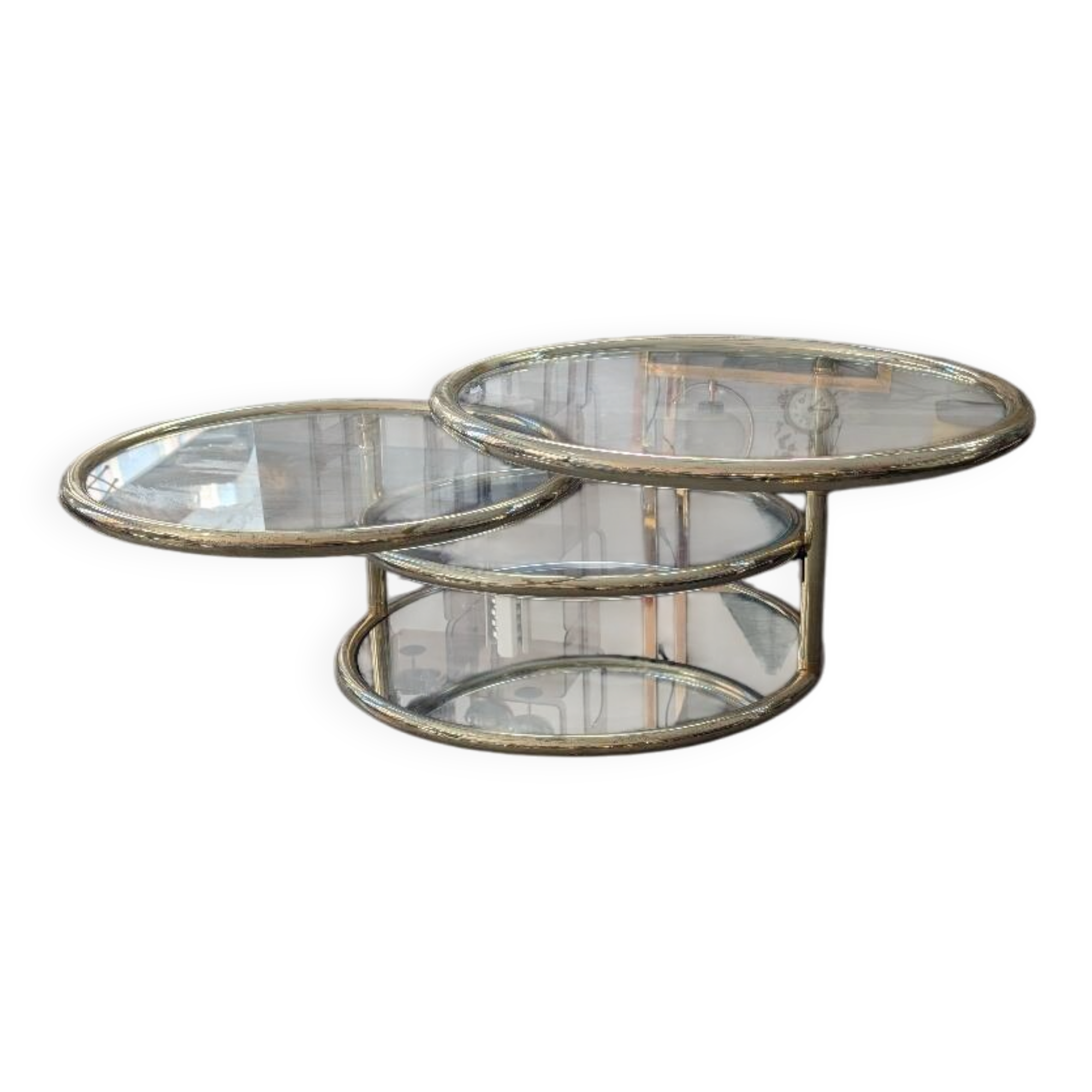 Gold brass coffee table with rotating trays.