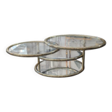 Gold brass coffee table with rotating trays.