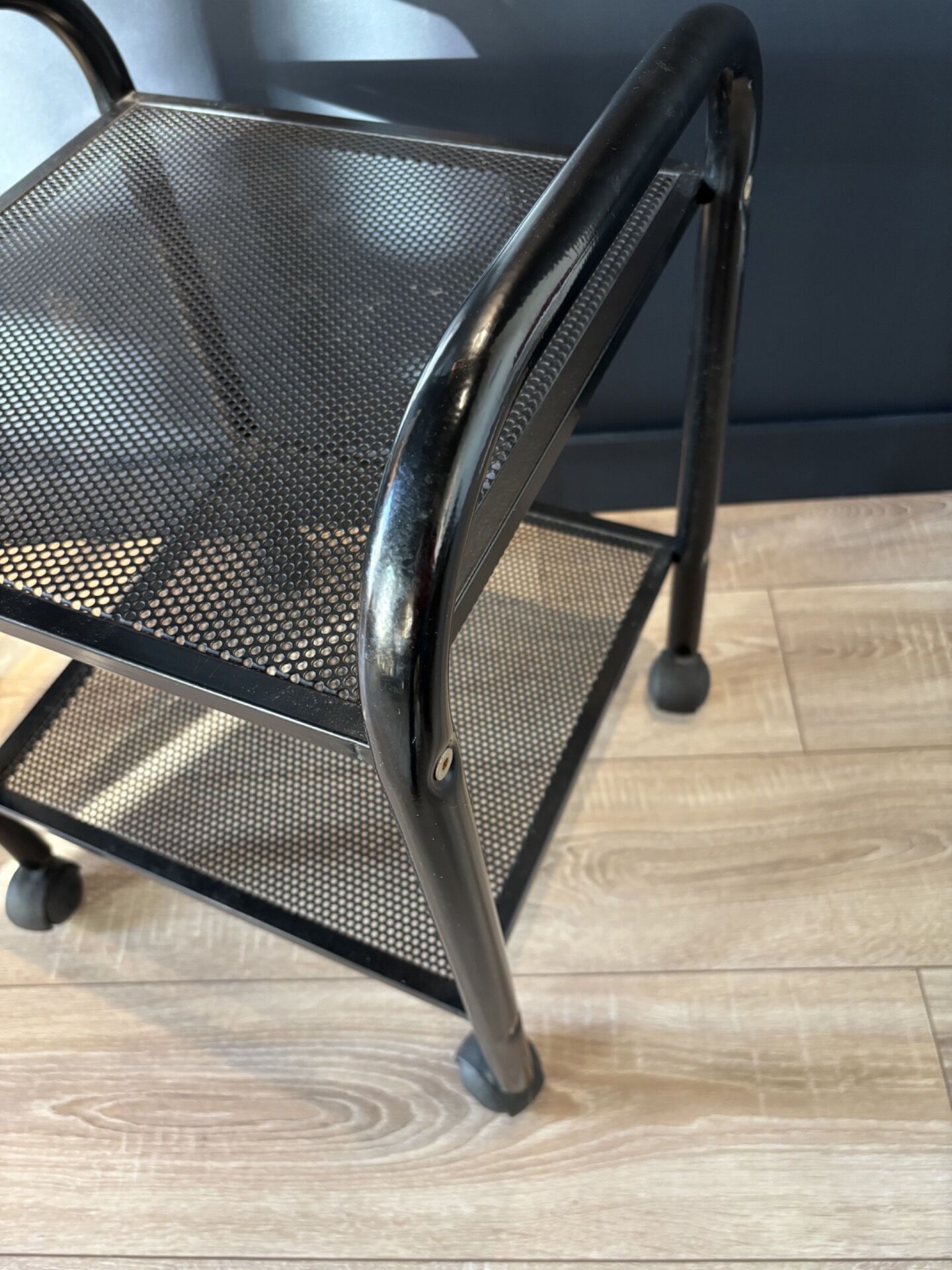 Vintage black metal rolling dessert trolley