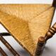 Mid Century Antiques spindle wood chaise with a rush seat.