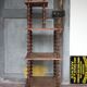 Napoleon III spool shelf, floor-standing shelf with brass tips.