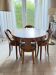 Extendable table and 4 chairs in cherry wood.