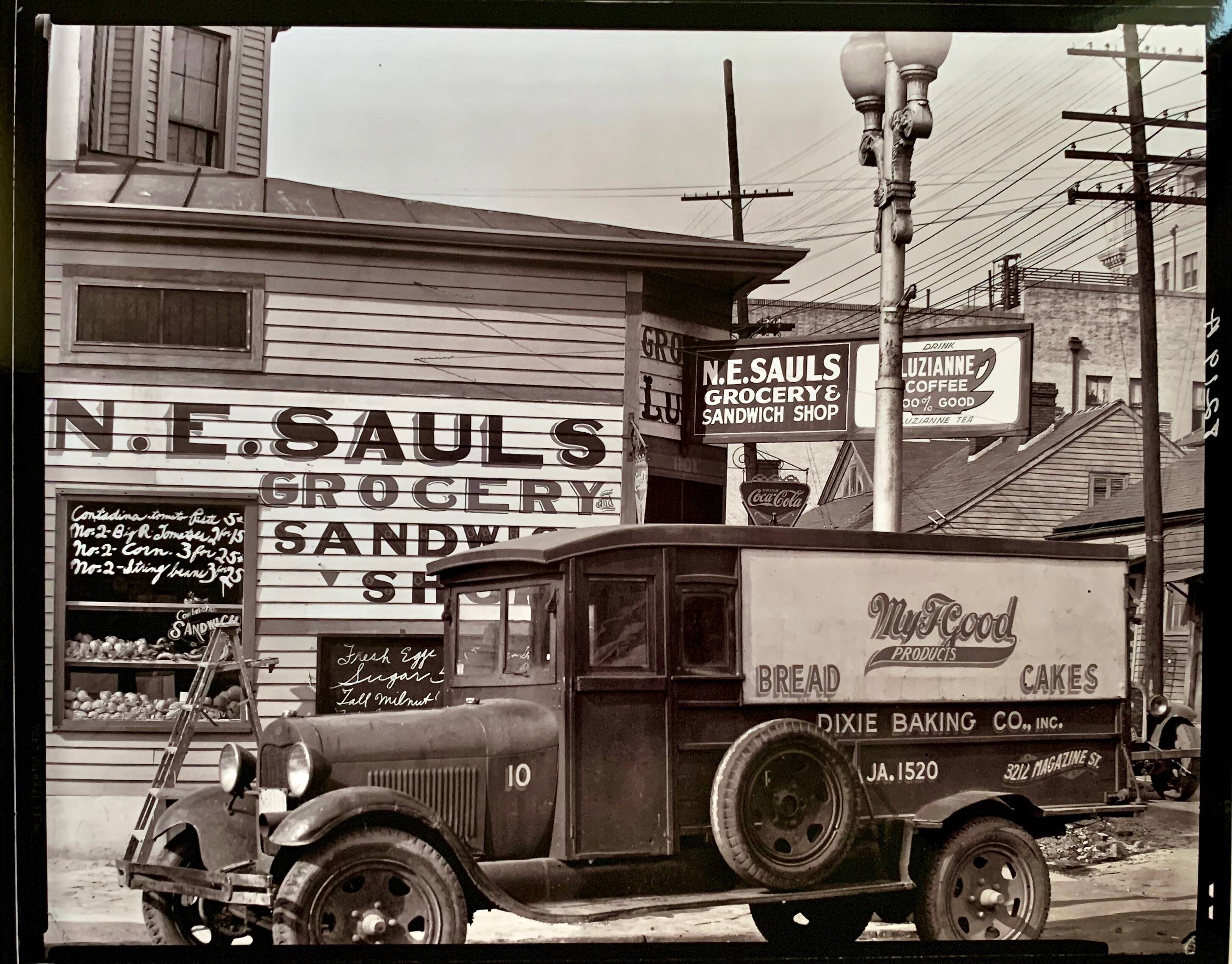 "Street corner in New Orleans, front of the NE Saul' sandwich shop