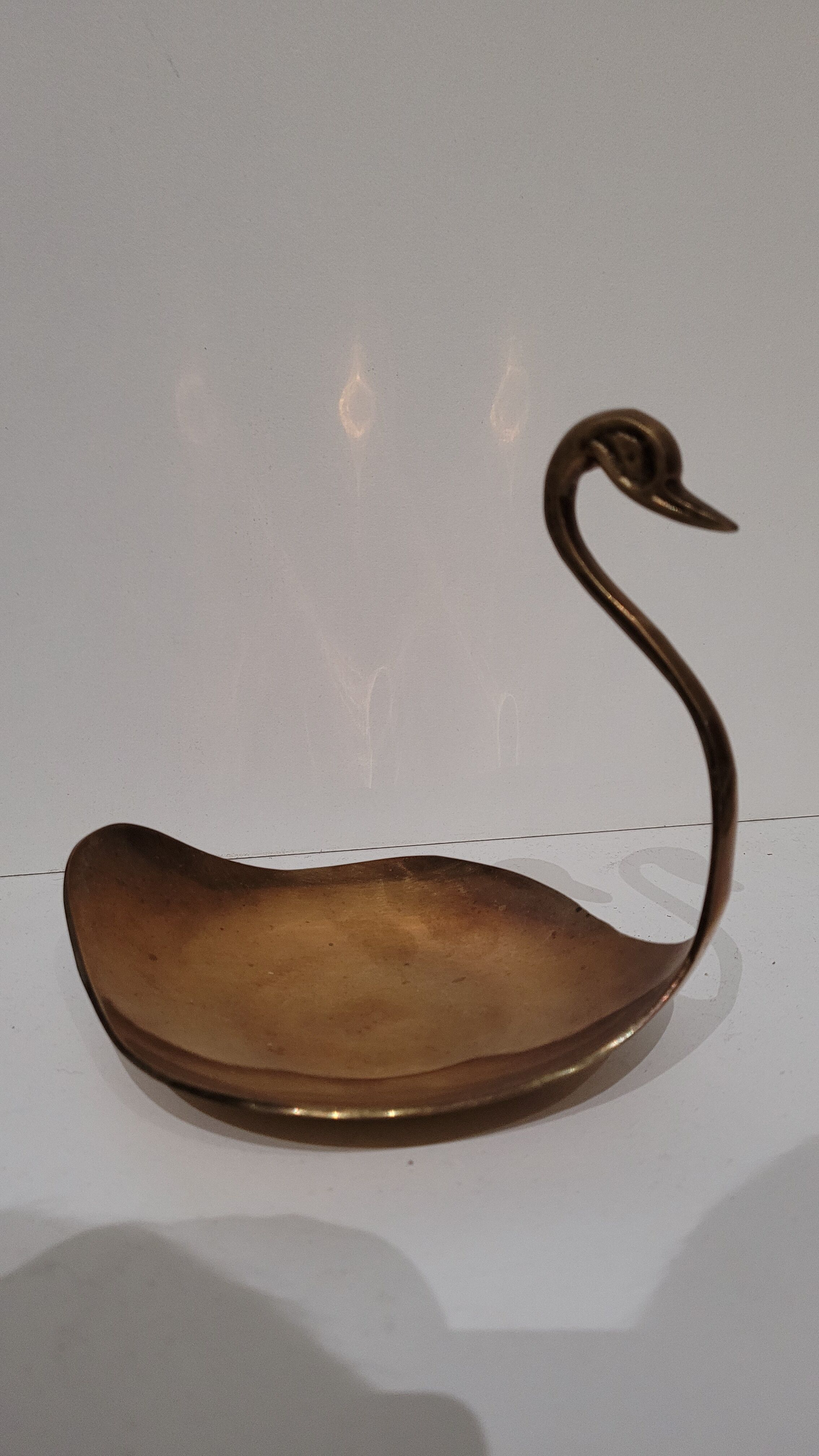 Empty swan brass pocket
