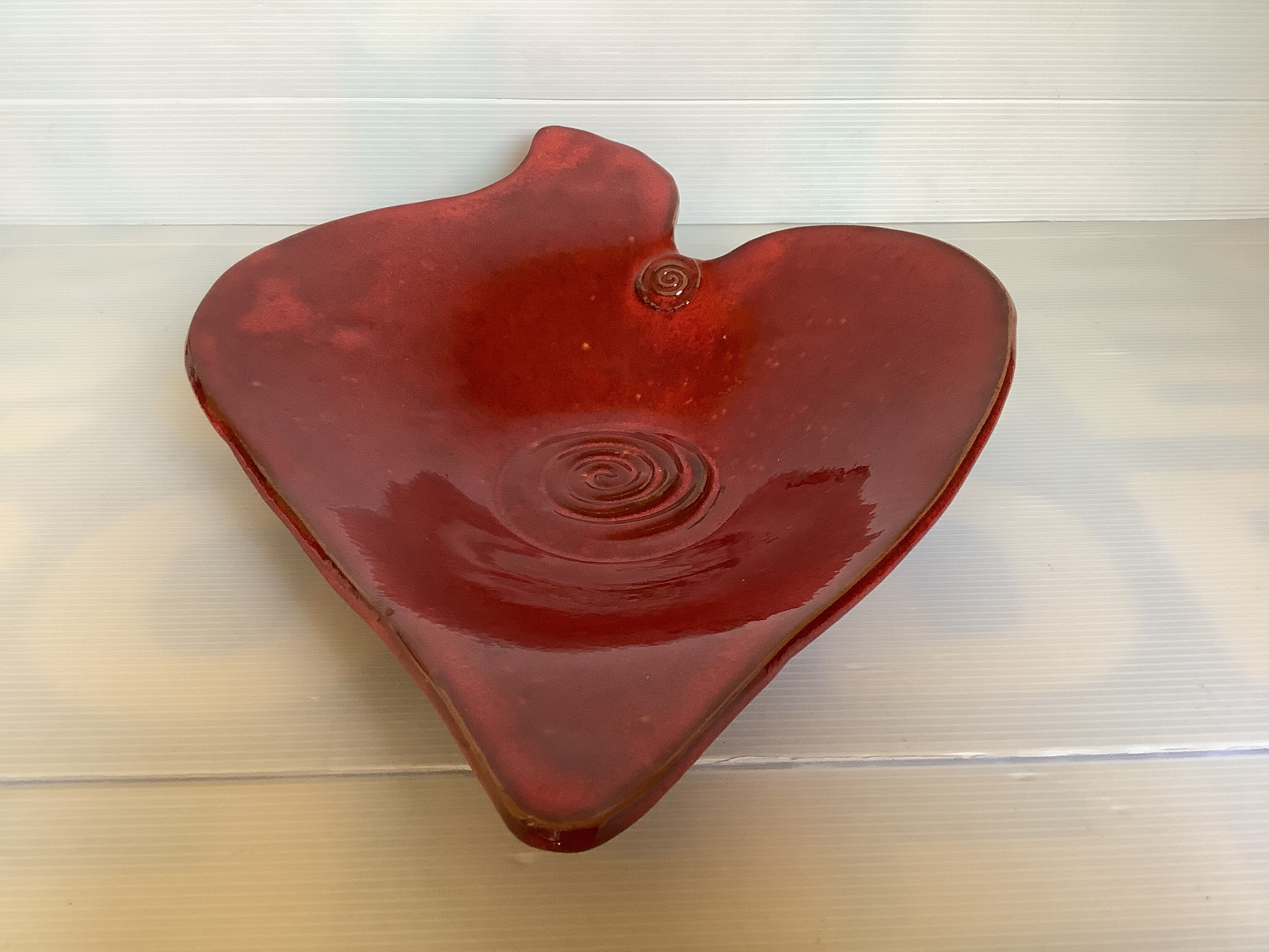 Red terracotta spiral pattern fruit bowl