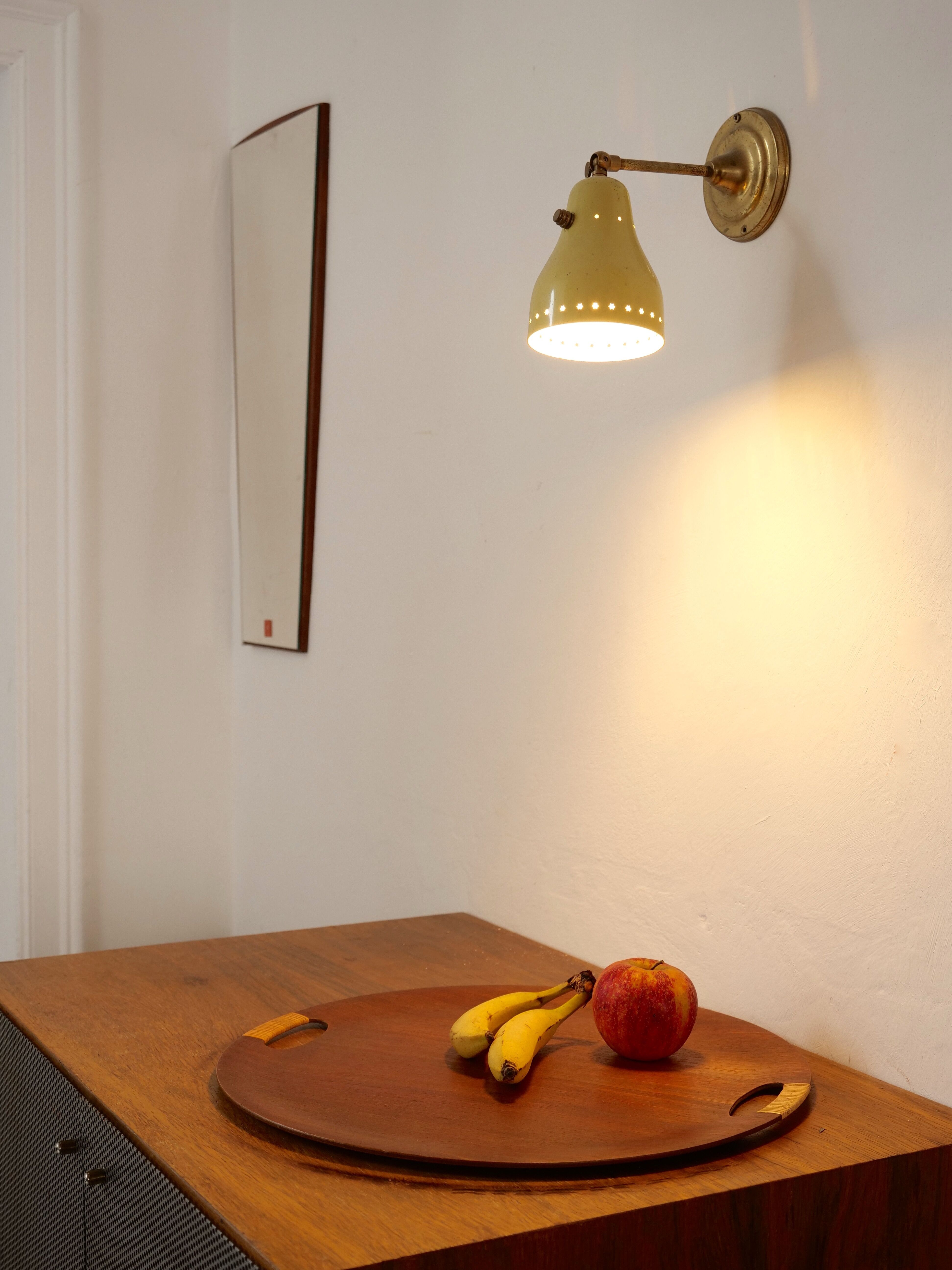 Wall lamp inlaiton and pale yellow lacquered metal