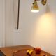 Wall lamp inlaiton and pale yellow lacquered metal