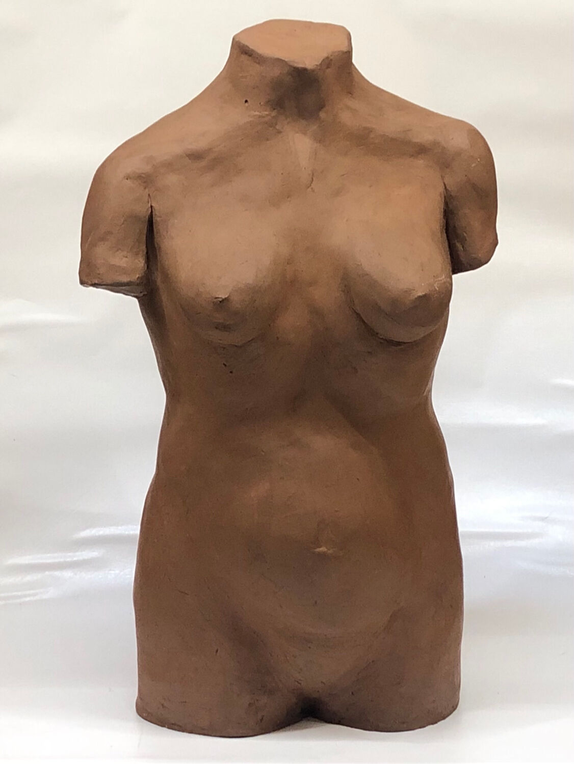 School bust of a female body in red clay terracotta