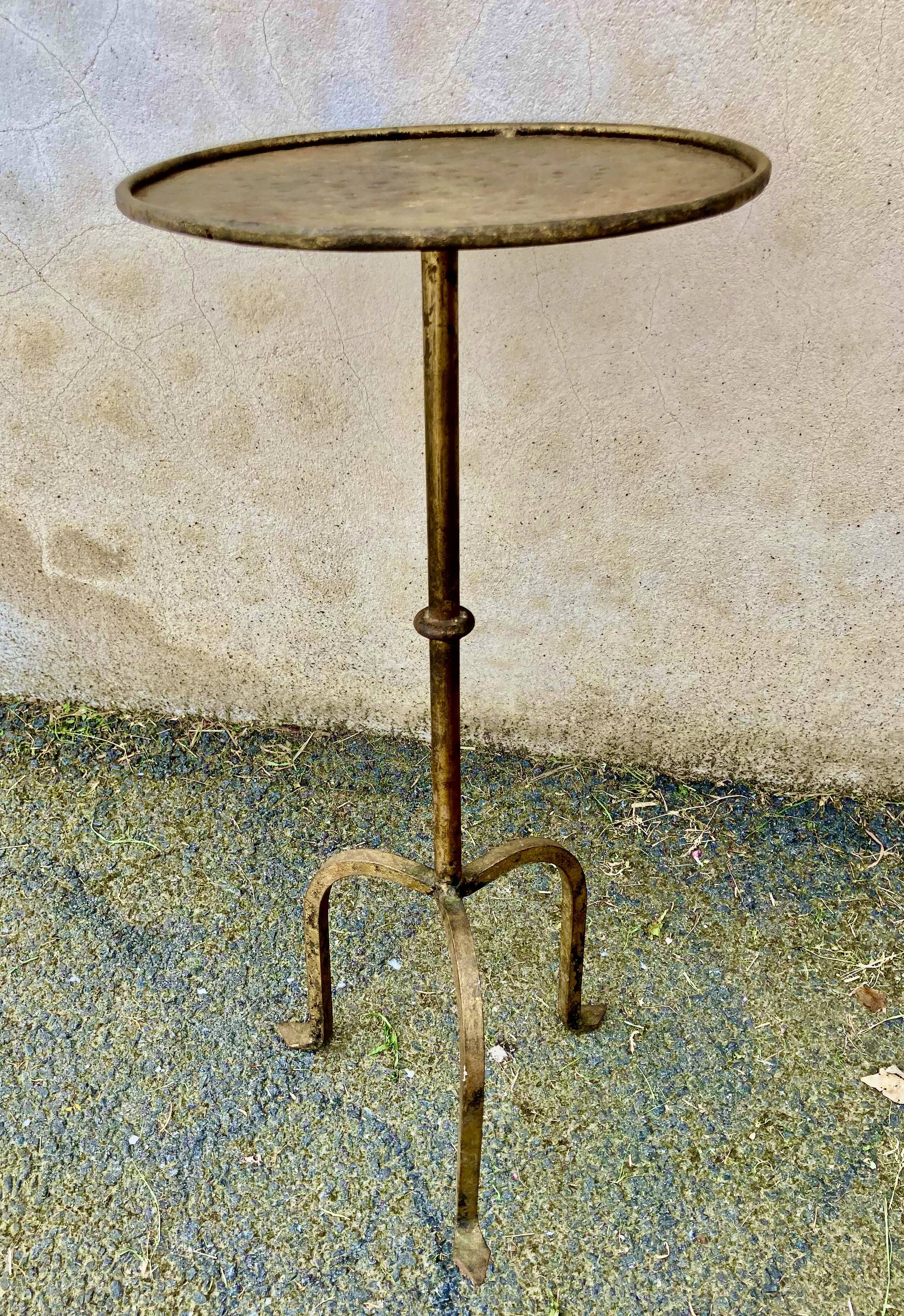 Henri POUENAT (1934-1987) Steel table or pedestal table with a golden patina