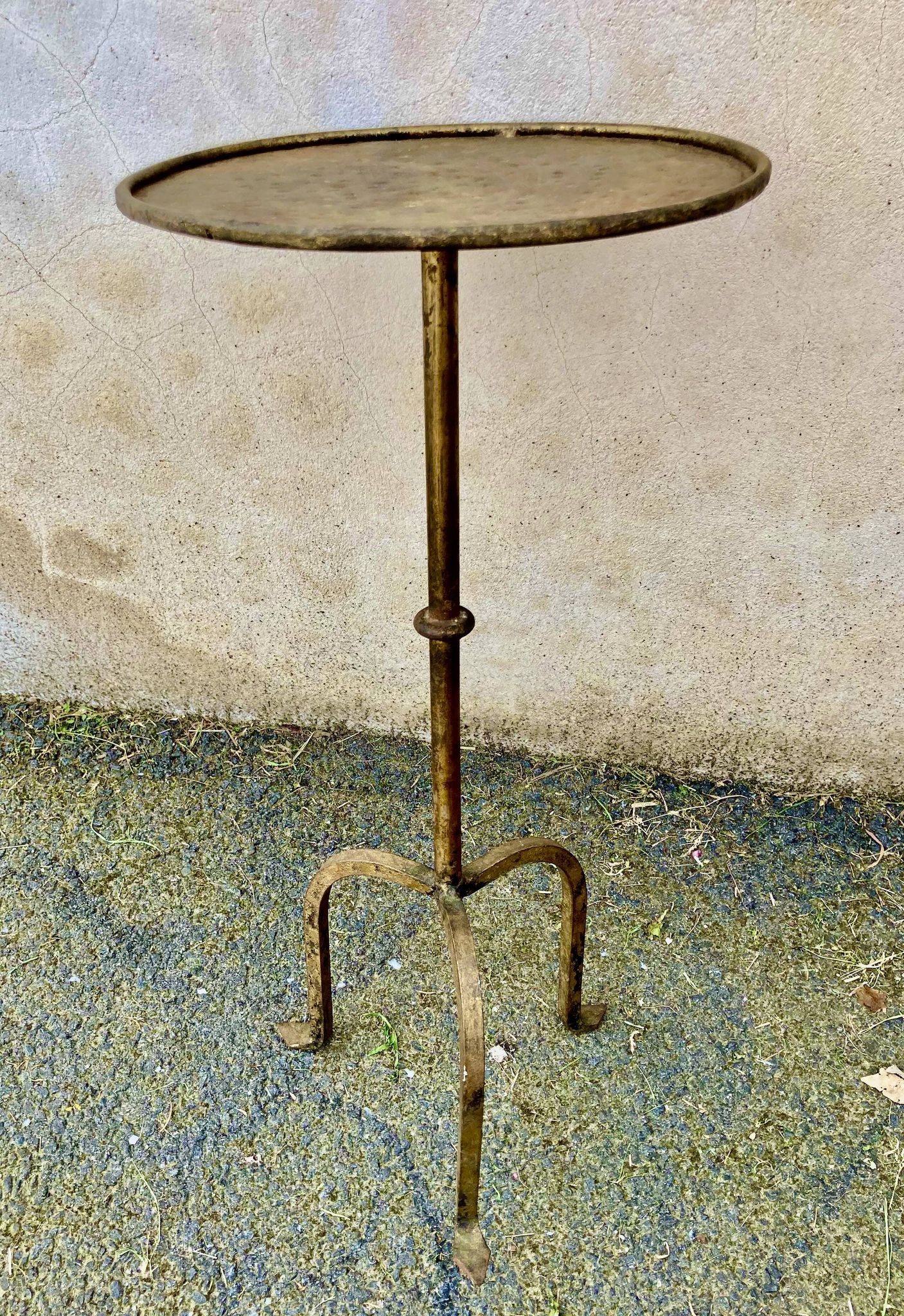 Henri POUENAT (1934-1987) Steel table or pedestal table with a golden patina