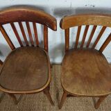4 mismatched signed bistro chairs