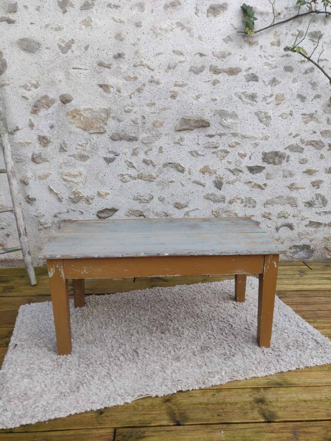 Patinated coffee table with a drawer