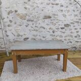 Patinated coffee table with a drawer