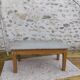 Patinated coffee table with a drawer