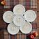 Vintage earthenware plates with a trompe l'oeil apple tart design