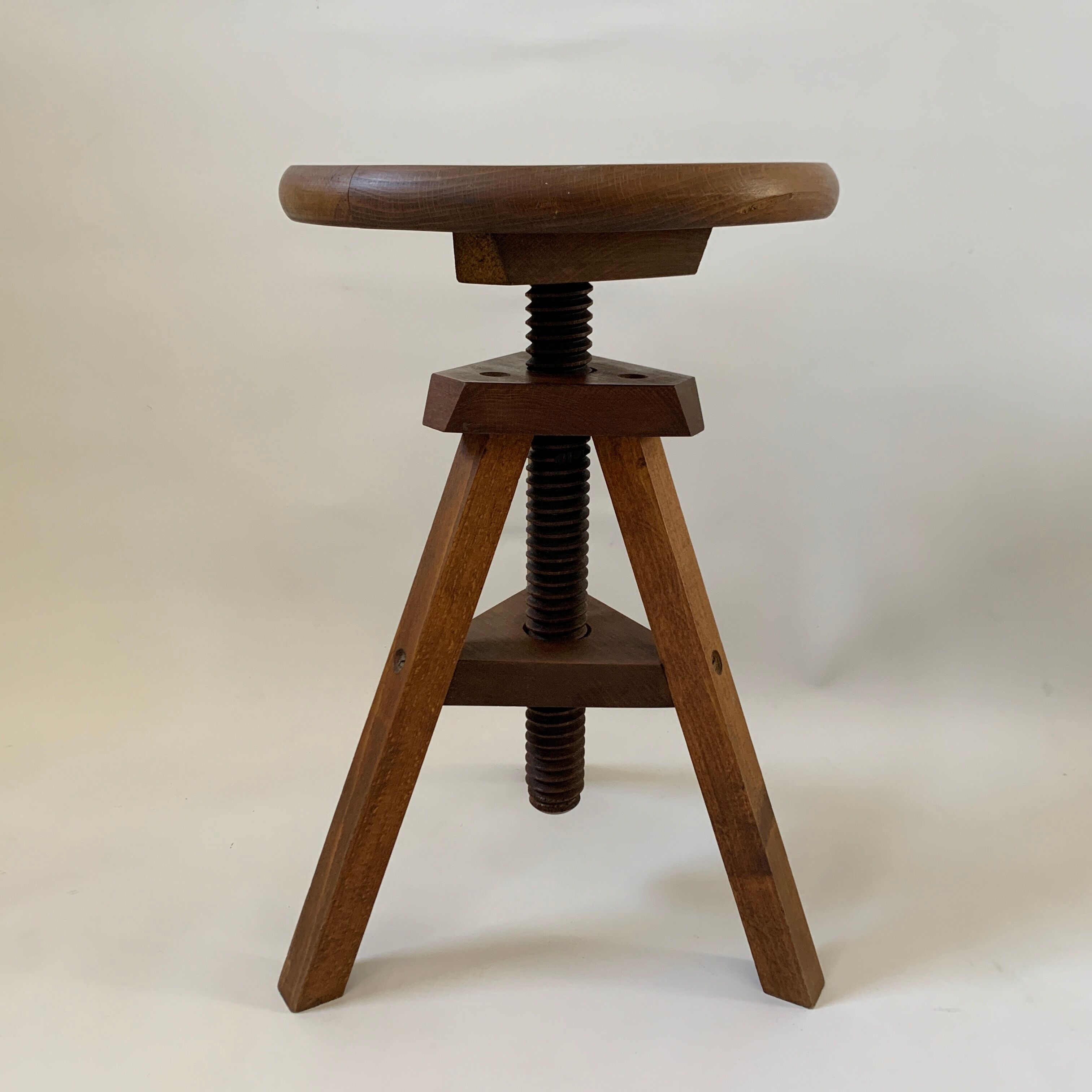 Wooden tripod stool with vintage screw