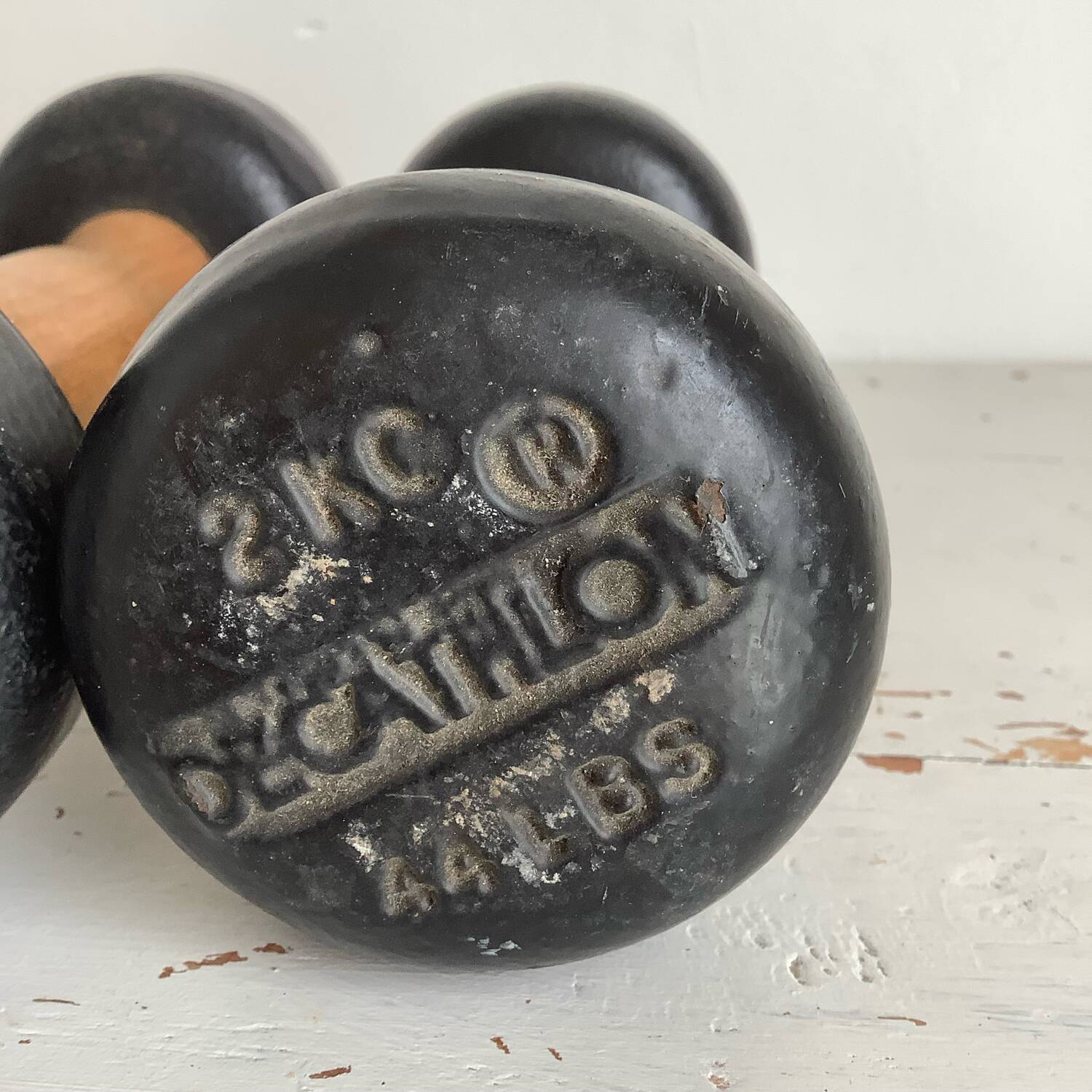Pair of wooden and cast iron dumbbells