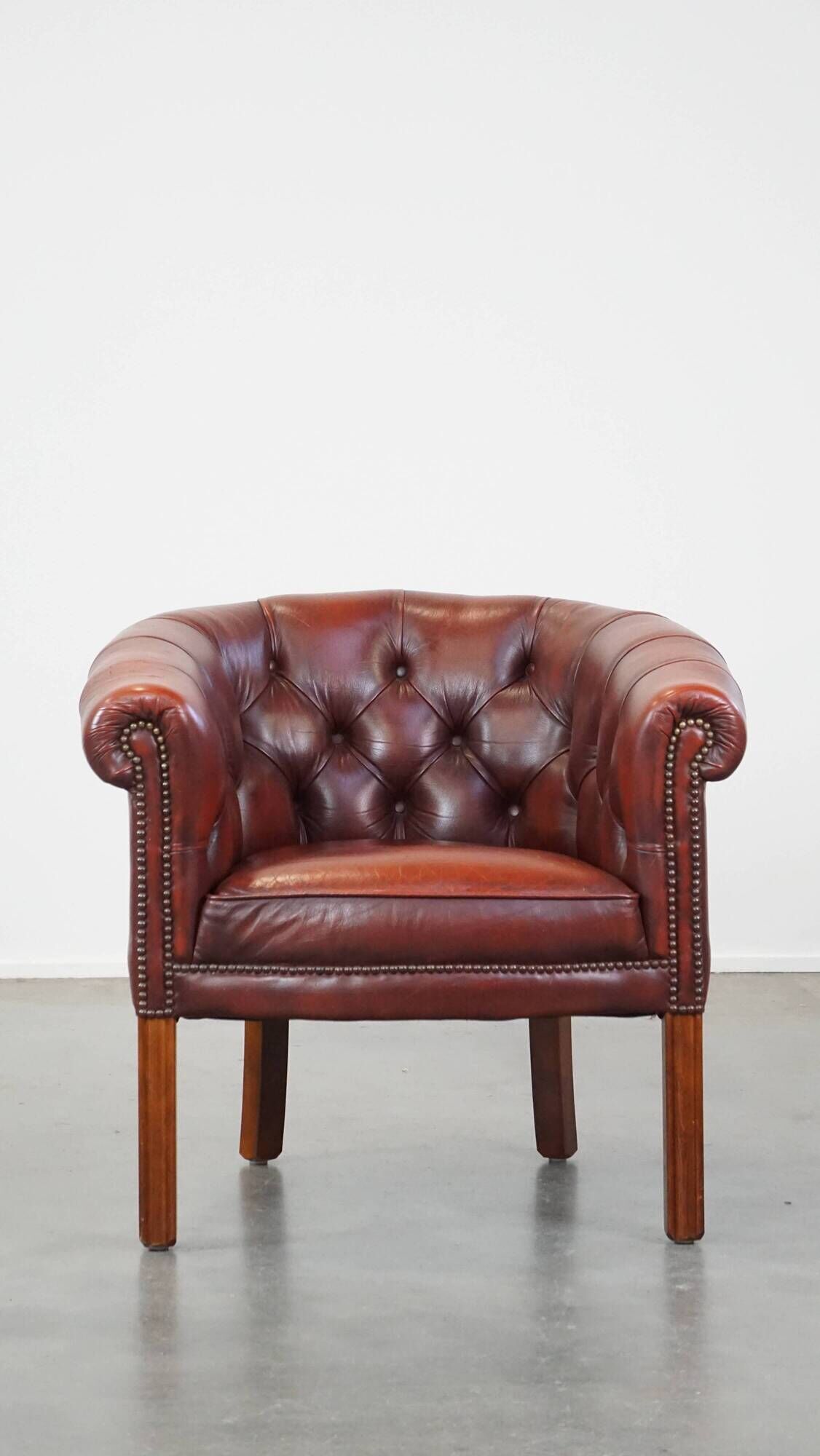 Red cow leather English chesterfield club chair