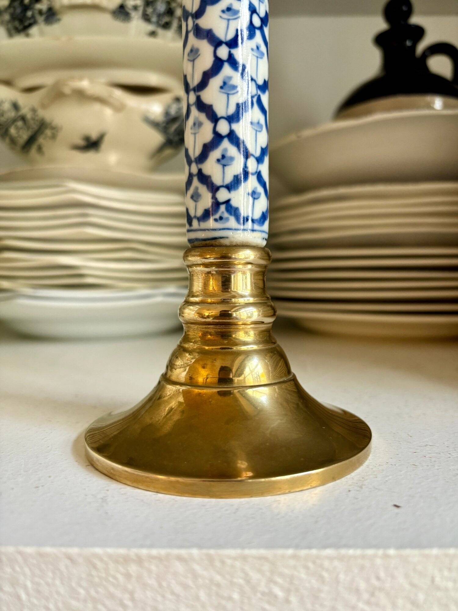 Candlestick in gilded brass and blue earthenware