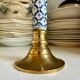 Candlestick in gilded brass and blue earthenware