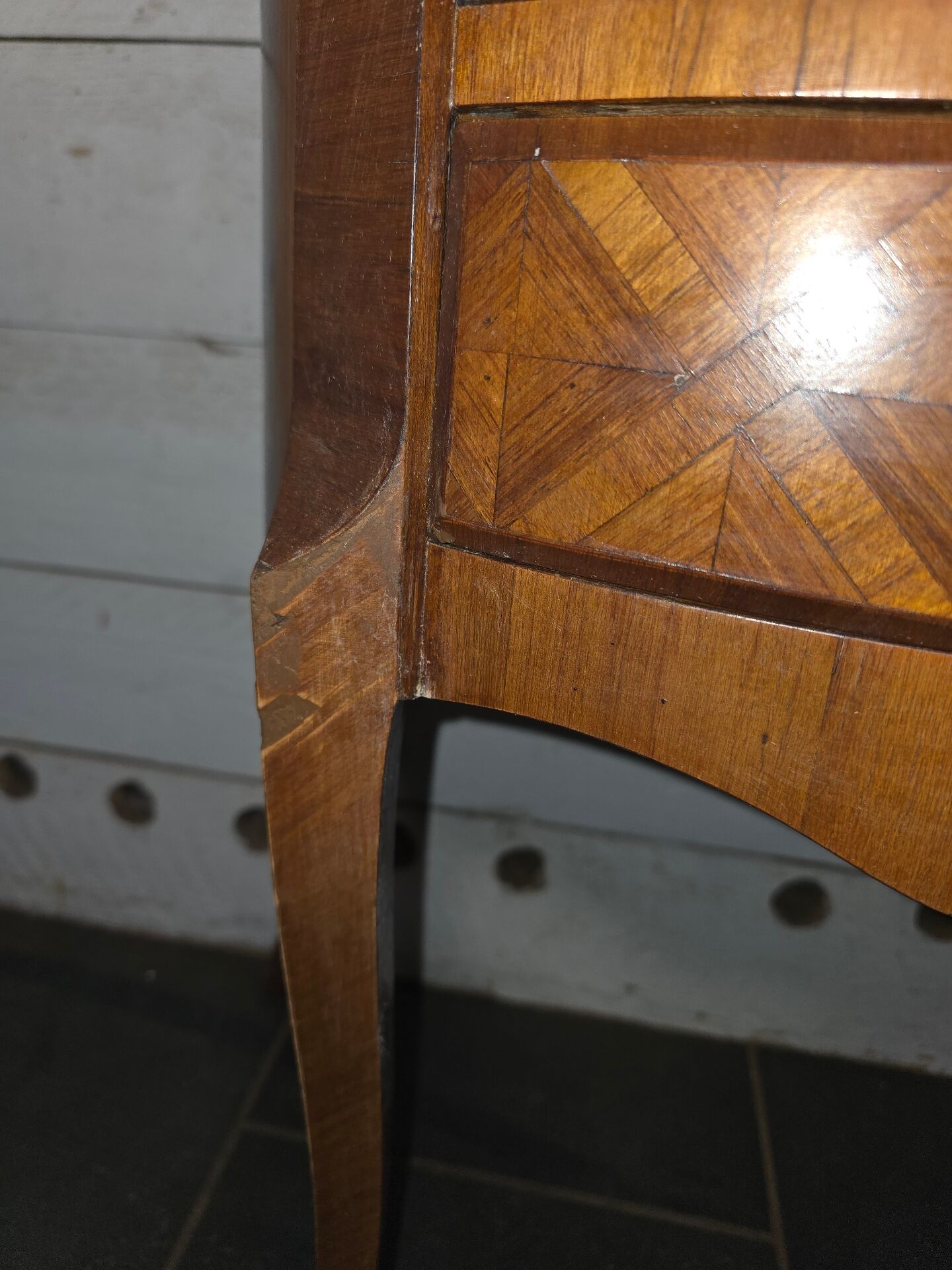 Small curved chest of drawers in Louis XV style with marquetry.