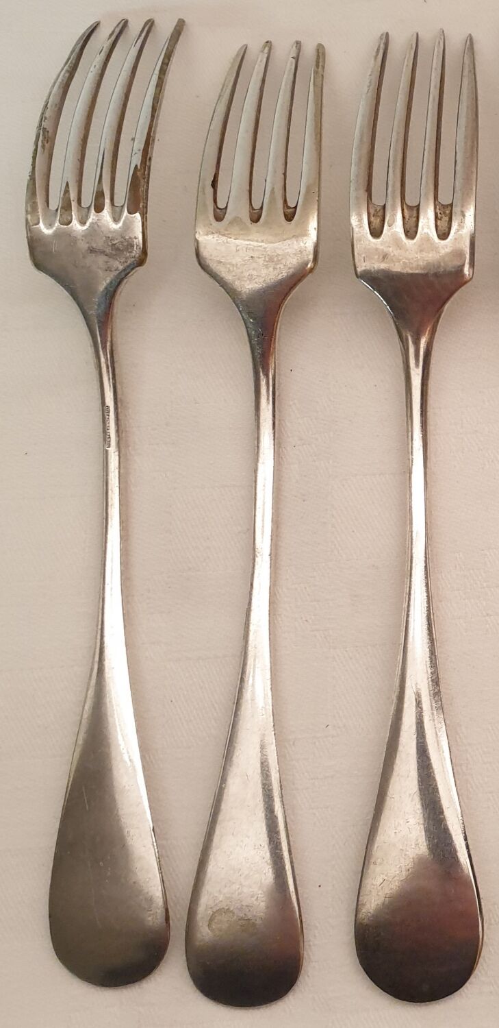 10 mismatched silver metal forks