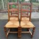4 dining chairs made of solid wood with straw seats, farmhouse style, medium oak, 20th century, 110cm.