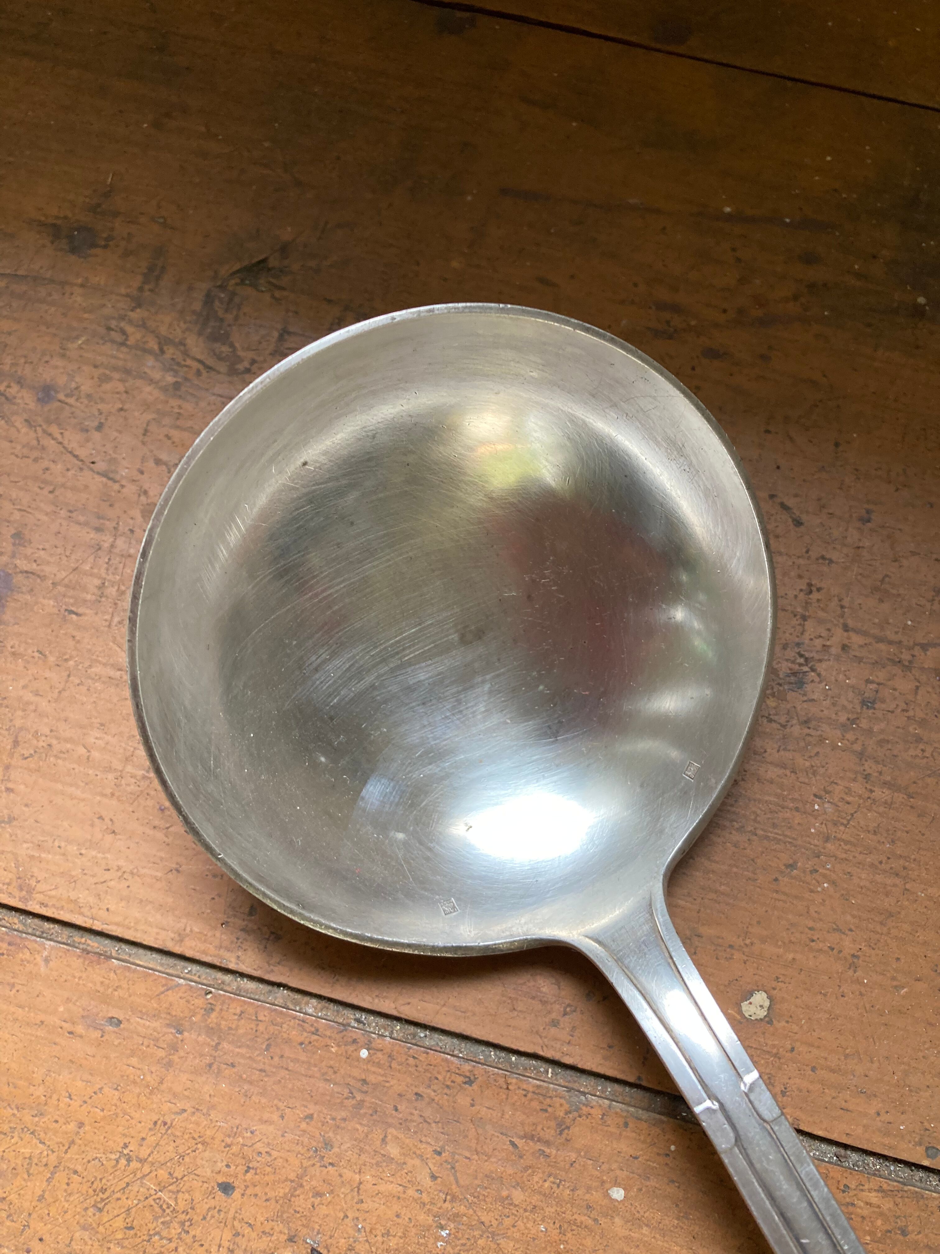 Old art deco ladle in silver metal Dixi