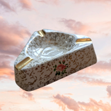Golden and white flowery ashtray