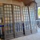 Two pairs of solid oak doors with small panes.