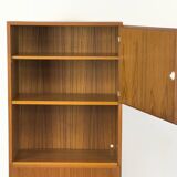 Narrow teak bookcase with two doors by Omann Jun, 1970s
