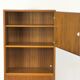Narrow teak bookcase with two doors by Omann Jun, 1970s