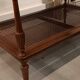 Coffee table / side table in mahogany with a rattan shelf.