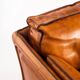Vintage club armchair by Roche Bobois. Camel buffalo leather. France, 1980s.