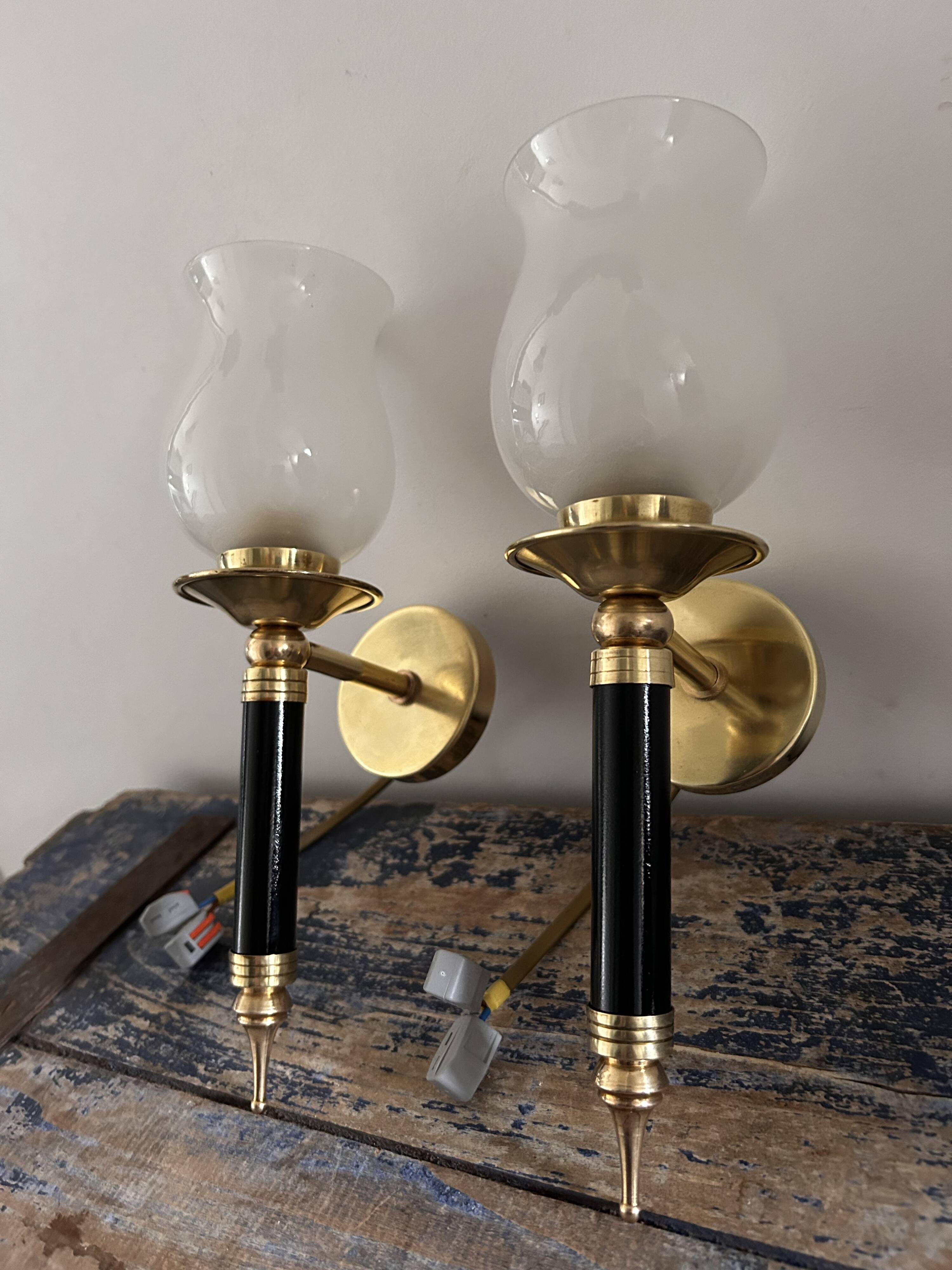 Pair of brass and black torchiere wall lights